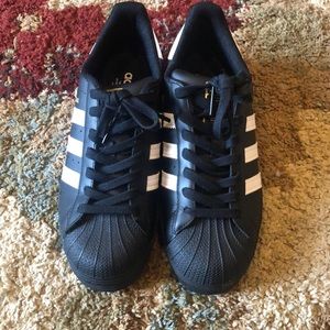 Brand new black Adidas Superstar